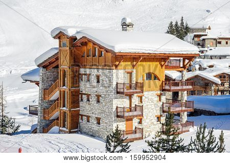 Alpine winter mountain landscape. French Alps covered with snow in sunny day. Val-d'Isere, France