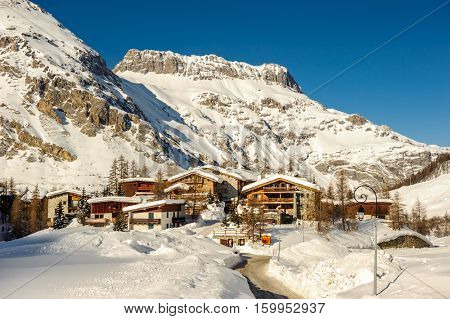 Alpine winter mountain landscape. French Alps covered with snow in sunny day. Val-d'Isere, France