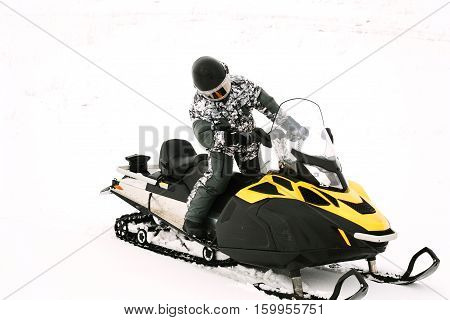 Man on snowmobile. Recreation concept on nature in winter holidays. Winter sports.