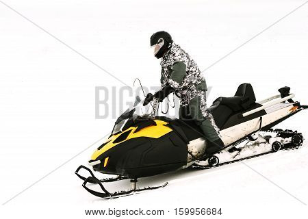 Man on snowmobile. Recreation concept on nature in winter holidays. Winter sports.