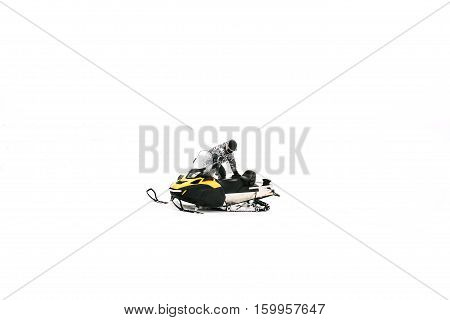 Man on snowmobile. Recreation concept on nature in winter holidays. Winter sports.