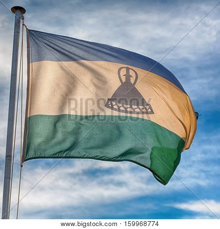 In The Cloudy Sky Waving Flag
