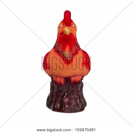 Toy piggy red rooster in profile against a white background