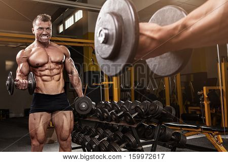 Muscular Bodybuilder Guy Doing Exercises With Dumbbell