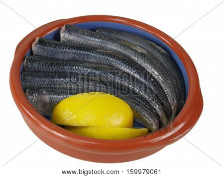 fishes herrings with lemon on a plate