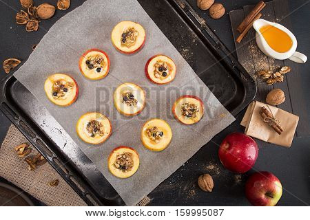 Preparing Baked Apples Stuffed With Honey And Walnuts On Baking Tray