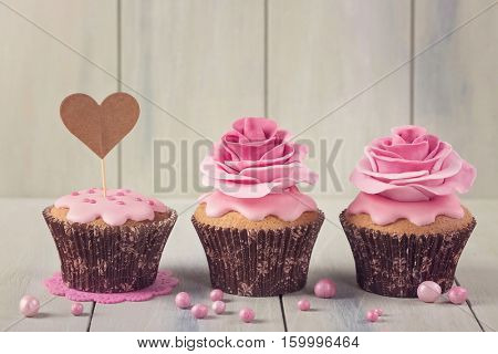 Cupcakes with heart cakepick for text