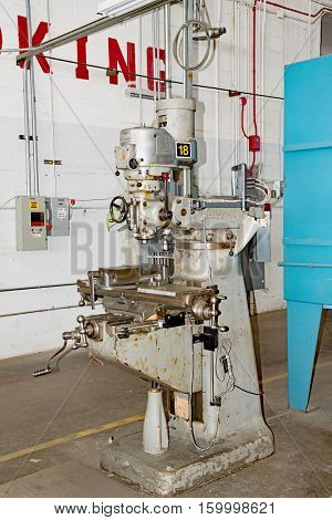 DAYTON, OHIO, USA - NOVEMBER 18, 2016: A Bridgeport milling machine in the Restoration Hanger of the National Museum USAF is used in metal millwork to restore aircraft & related items.

