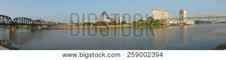 The Red River Meanders By Under Bridges And By The Waterfront In Shreveport Louisiana