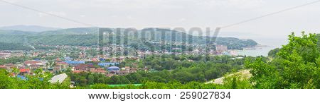 Panorama Of A Small Village By The Sea Near The Mountain