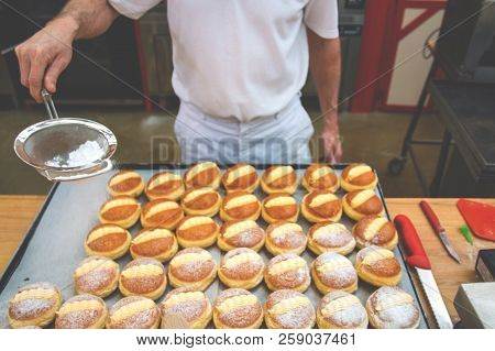 Sprinkle The Pastry With Powdered Sugar Through A Sieve.