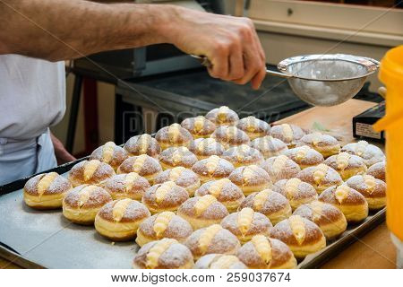 Sprinkle The Pastry With Powdered Sugar Through A Sieve.