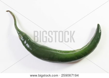 Single Curved Chilaca Pepper, Ample Copy Space, Isolated On White, Horizontal Aspect
