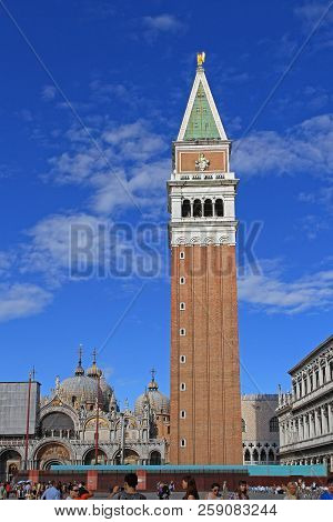Venice, Italy - June 16, 2010: San Marco Campanile Bell Tower And Basillica In Venice, Italy.