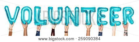 Blue alphabet balloons forming the word volunteer