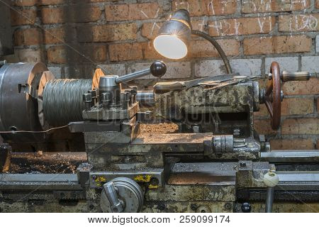 Old Machinery In A Factory From The Mid-20th C. Working Machine-tool. Old Lathe.