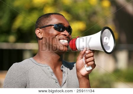 an african american male model uses a megaphone to get his message heard loud and clear