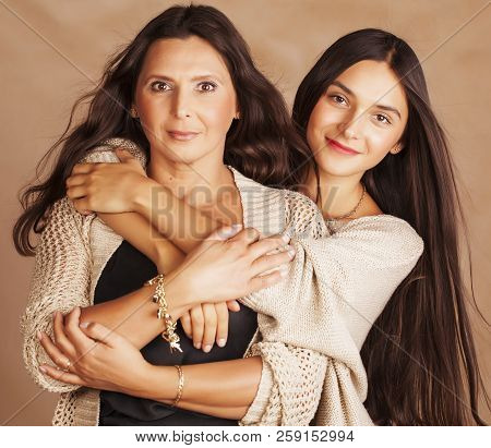 Cute Pretty Teen Daughter With Mature Mother Hugging, Fashion St