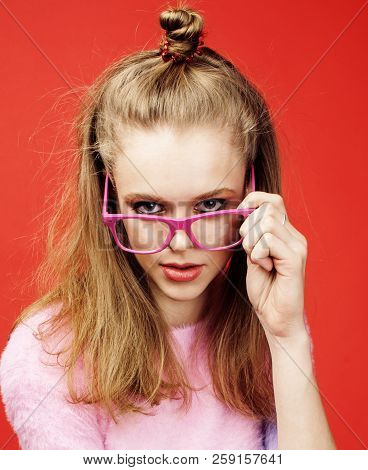 Young Pretty Teenage Girl On Bright Red Background, Happy Smilin
