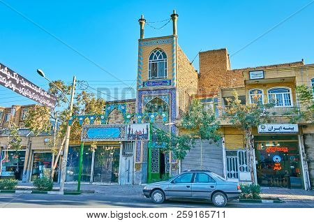 Kashan, Iran - October 22, 2017: The Narrow Building With Two Tiny Minarets And Islamic Pattern Of B