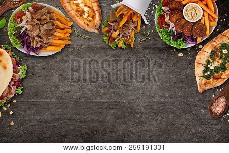 Top down view on traditional turkish meals on black stone table. Close-up.
