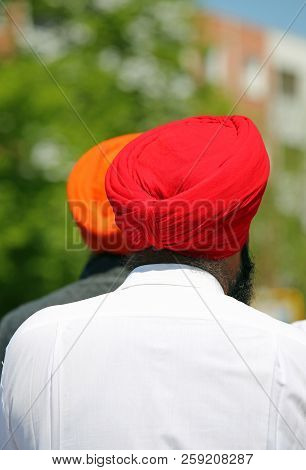 Sikh Man With Red Turban And White Shirt