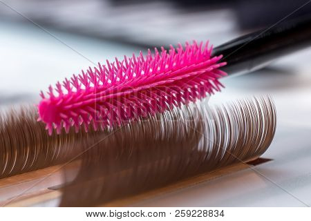 Eyelash Brown Extension Procedure. Set Lashes Close Up Pink Comb