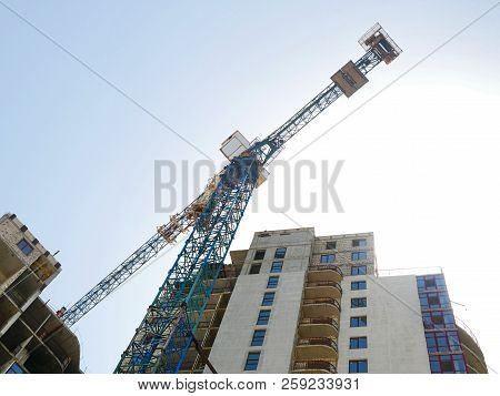 Crane. Construction Crane. Construction Crane On The Background Of The Building.