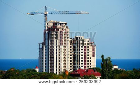 Building Under Construction On A Background Of A Sea Coast. Construction Site.