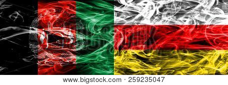 Afghanistan Vs South Ossetia Smoke Flags Placed Side By Side. Thick Colored Silky Smoke Flags Of Afg