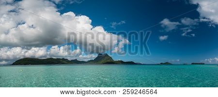 Panoramic View Of Vaitape, Blue Lagoon, White Sandy Beach And Otemanu Mountain At Bora Bora Island, 
