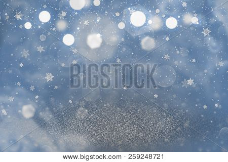 Blue Beautiful Shiny Abstract Background Glitter Lights With Falling Snow Flakes Fly Defocused Bokeh