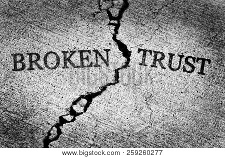 Old cracked sidewalk broken and dangerous cement lost trust untrustworthy