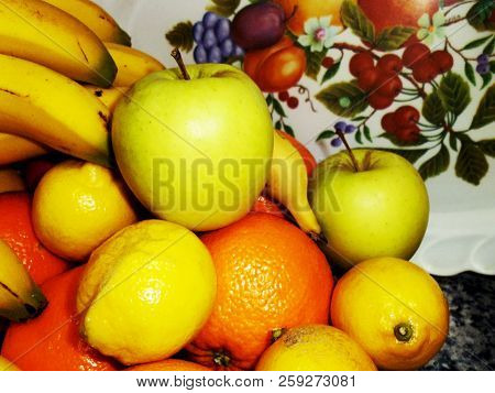 Bodegon Of Oranges, Apples, Bananas And Lemons