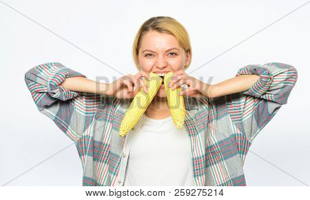 Girl Rustic Style Bites Ripe Corn. Girl Eating Uncooked And Unprocessed Food. Woman Farmer Eat Two Y