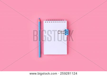 Top View Of Blank Notebook With Peb On Colorful Background Pink With Copy Space.