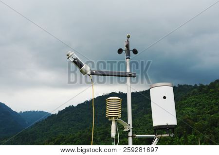 Pluviometer Or Rain Gauge In Mountain Background With Rain Cloud On Sky