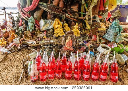 Rawai Beach, Phuket, Thailand - October 27, 2013: Beachside Buddhist Shrine With Offerings Under Tre