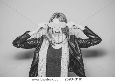 Woman With Autumn Leaves As Glasses In Leather Jacket. Girl With Orange Leaves. Season And Autumn Ho