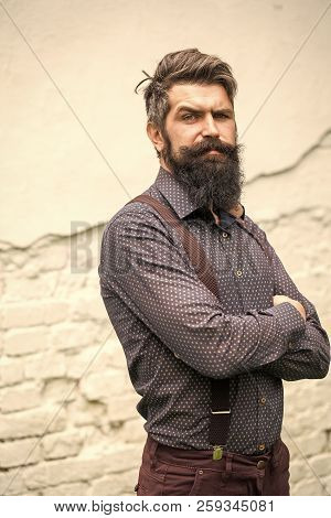 Closeup View Of One Handsome Senior Stylish Man With Black Hair And Long Lush Beard In Blue Shirt St