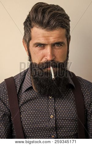 Closeup View Of One Handsome Senior Stylish Man With Black Hair And Long Lush Beard In Blue Shirt St