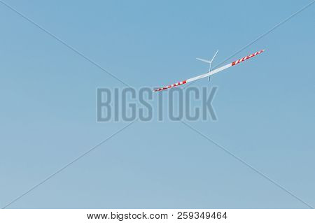 Rc Remotely Controlled Soaring Plane Model Sailplane On Blue Sky In Brisk Wind