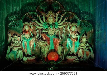 Goddess Durga Idol At Decorated Durga Puja Pandal, Shot At Colored Light, At Kolkata, West Bengal, I