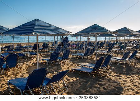 Malia. Crete, Greece - July 1, 2018: Sunbeds At The Beach In Malia On Crete, Greece