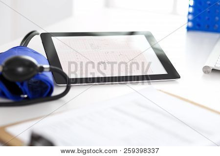 Workplace Of Doctor. Tablet Ps Showing Heart Diagrams Closeup. Healthcare And  Cardiology In Medicin