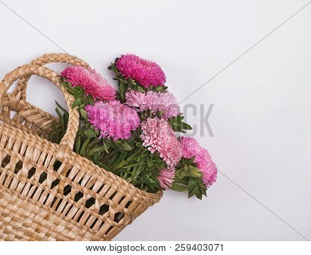 Pnk Autumn Flowers In A Straw Basket