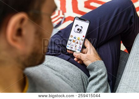 London, Uk - Sep 21, 2018: Man Using The New Panda Ar Memoji Emoji Face On Apple Iphone Xs With The 