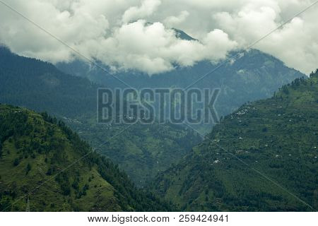 Villages In The Mountains And Heavy Clouds