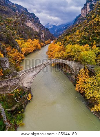 Aerial View Of Konitsa Old Bridge And Aoos River An Autumn Day, Greece.