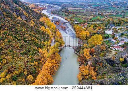 Aerial View Of Konitsa Old Bridge And Aoos River An Autumn Day, Greece.